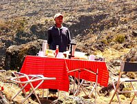 Godlove, the Assistant Guide, supervising lunch preparation.