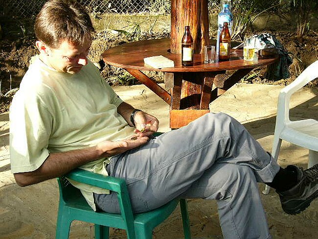 Counting his Tanzanian Shillings